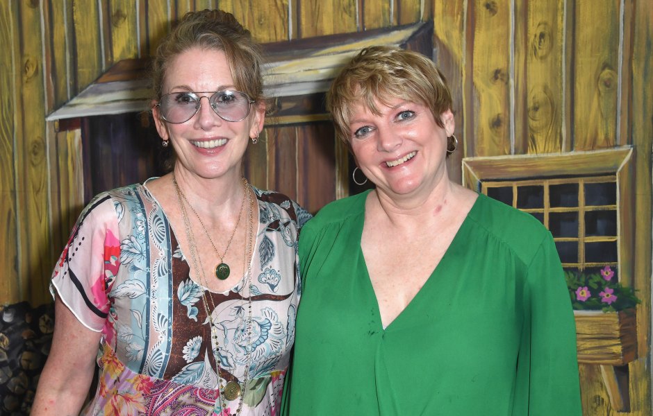 Melissa Gilbert wears sunglasses and patterned top while hugging Alison Arngrim