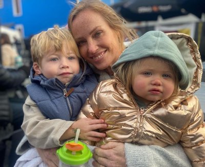Mina Starsiak Hawk holds kids Jack and Charlotte in her lap