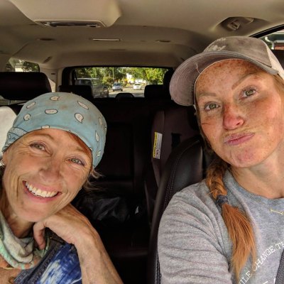 Karen E. Laine and Miina Starsiak Hawk sit next to each other in car