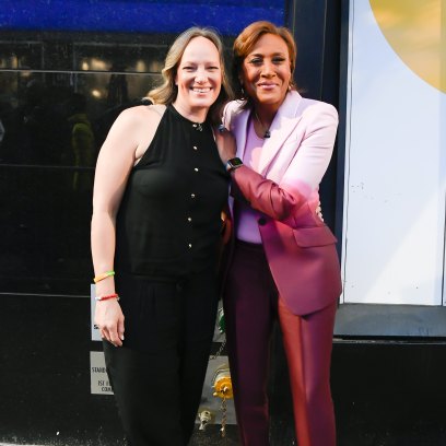 Robin Roberts wears pink pantsuit next to partner Amber Laign