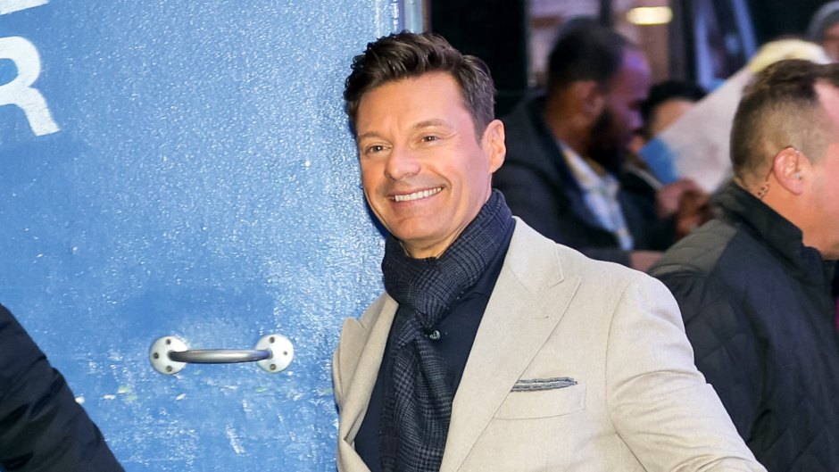 Ryan Seacrest wears khaki suit with matchiing shoes