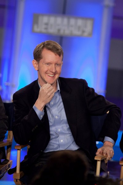 Ken Jennings laughs while sitting in a chair