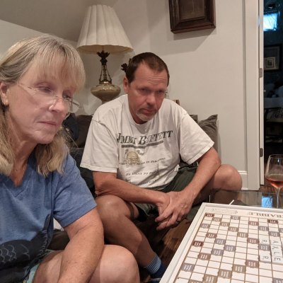 Karen E. Laine sits next to husband Roger while playing a game