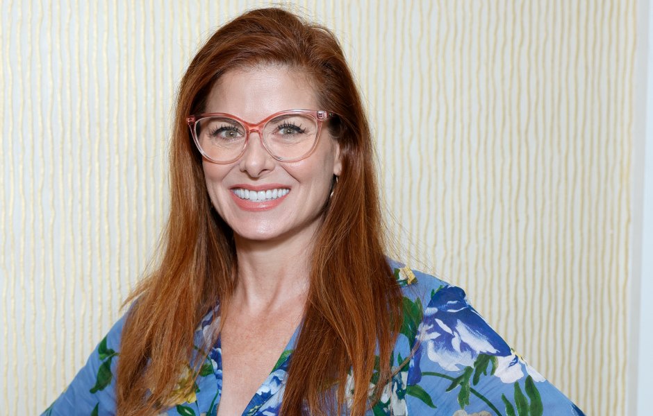Debra Messing wears blue floral dress and glasses