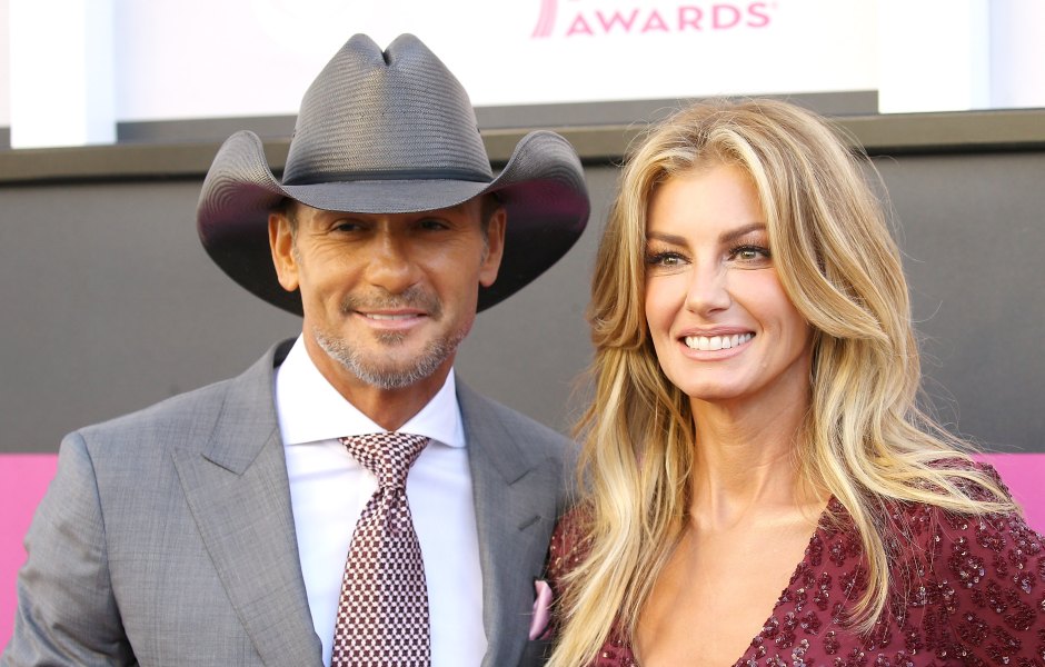 Tim McGraw wears a gray cowboy hat next to Faith Hill