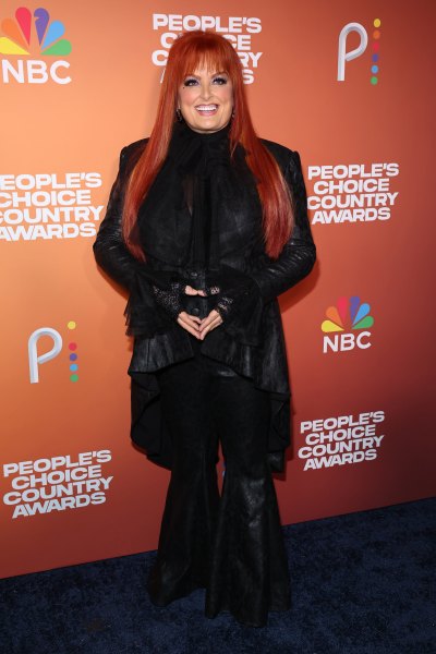 Wynonna Judd wears black leather outfit and black shoes
