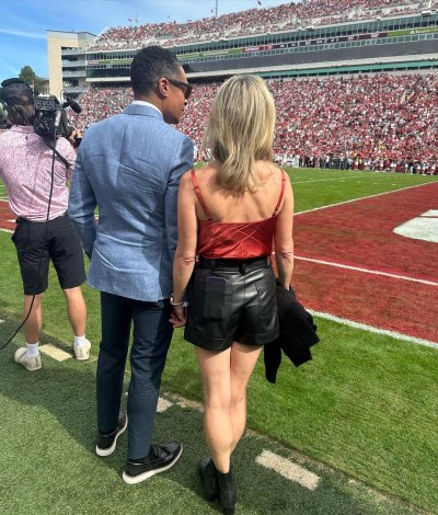 Amy Robach wears leather shorts and red top on football field