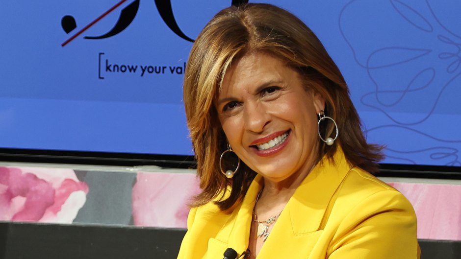 Hoda Kotb sits in chair while wearing a yellow pantsuit