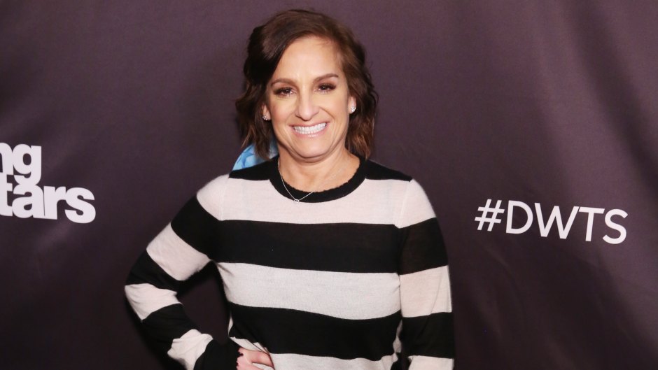 Mary Lou Retton wears striped sweater and black pants