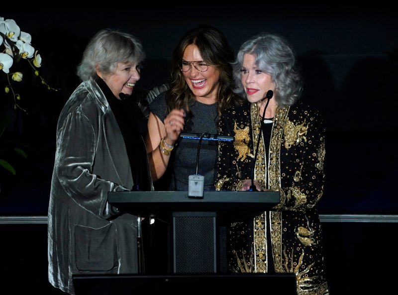 Mariska Hargitay and Jane Fonda stand together at podium on stage