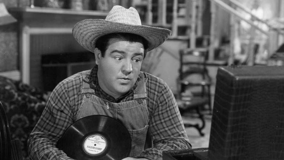 Lou Costello plays records in a scene from the film 'Little Giant'