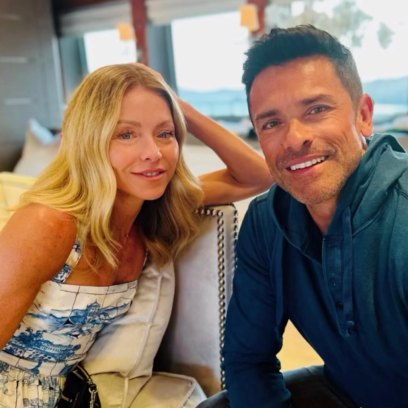 Kelly Ripa sits next to Mark Consuelos on couch