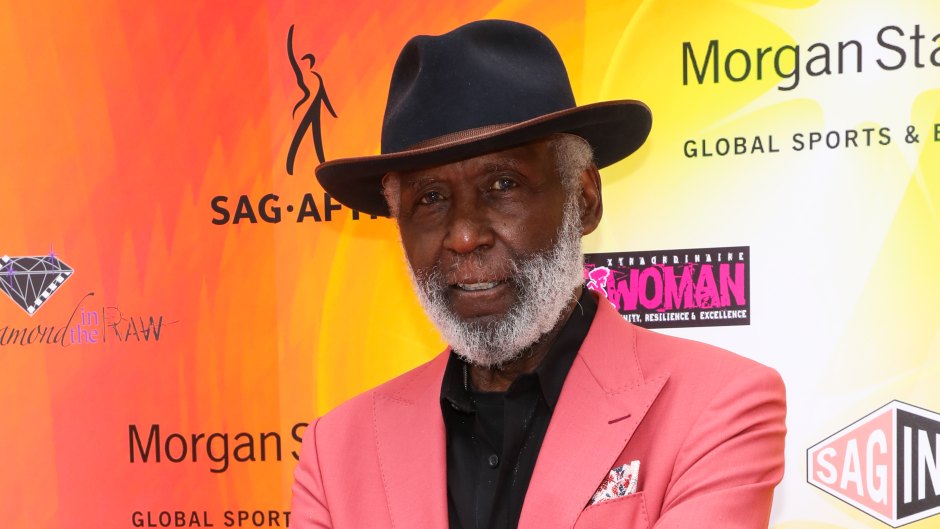 Richard Roundtree wears pink suit jacket with black hat