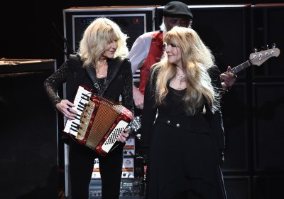 Christine McVie and Stevie Nicks of music group Fleetwood Mac perform on stage