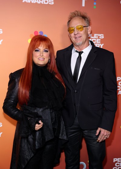 Wynonna Judd wears all-black ensemble on red carpet with husband Cactus Moser
