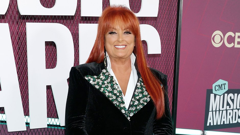 Wynonna Judd wears suede suit with patterned color