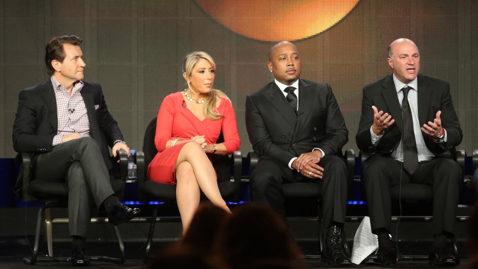'Shark Tank' cast sits in chairs on stage