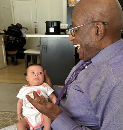 Al Roker smiles while looking down at his granddaughter Sky