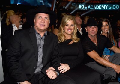 Garth Brooks, Trisha Yearwood, Kenny Chesney and Mary Nolan sit together during the 50th Academy of Country Music Awards