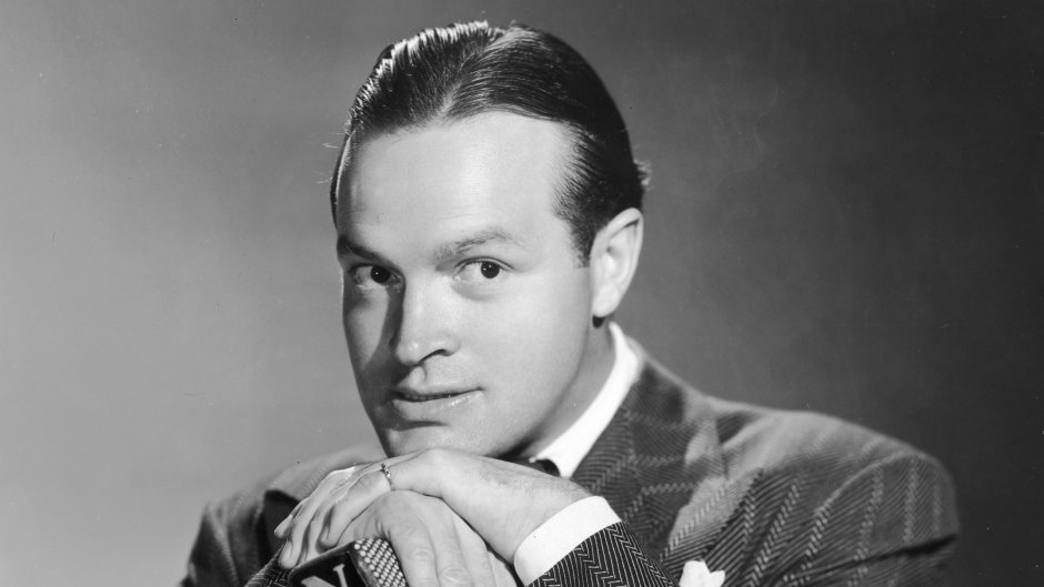 Bob Hope stands at microphone