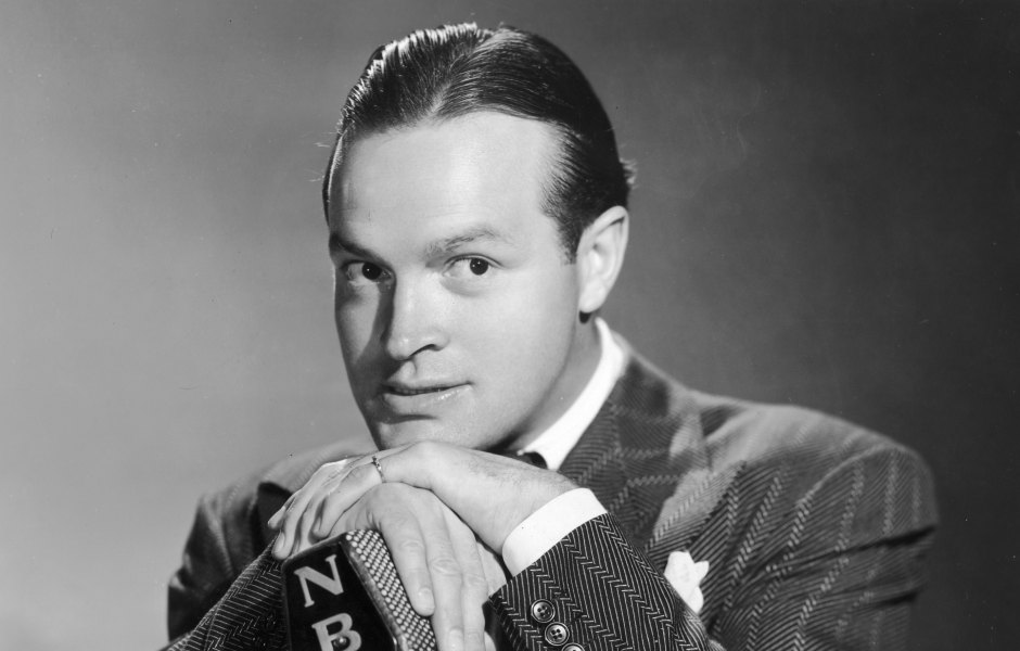 Bob Hope stands at microphone