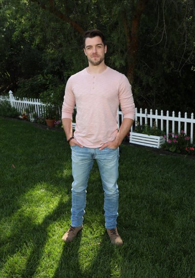 Dan Jeannotte wears pink long-sleeve shirt and jeans