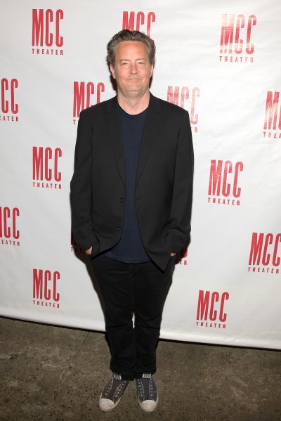Matthew Perry wears black suit with Converse sneakers