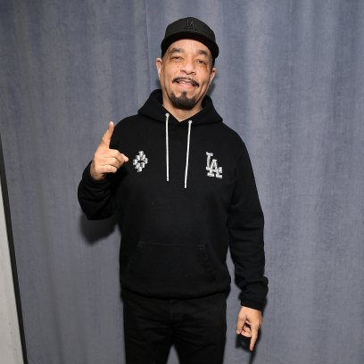 Ice-T wears black hooded sweatshirt and black pants