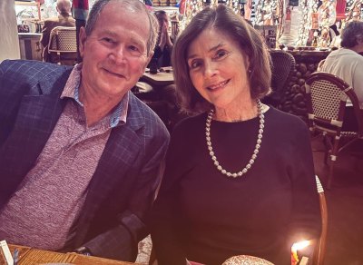 George W. Bush and Laura Bush pose together at dinner in restaurant