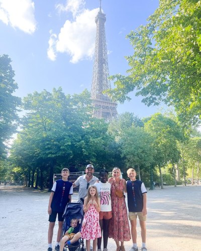 The Marrs family stands in front of the Eiffel Tower