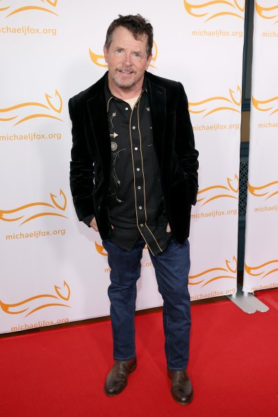 Michael J. Fox wears black suit jacket and jeans
