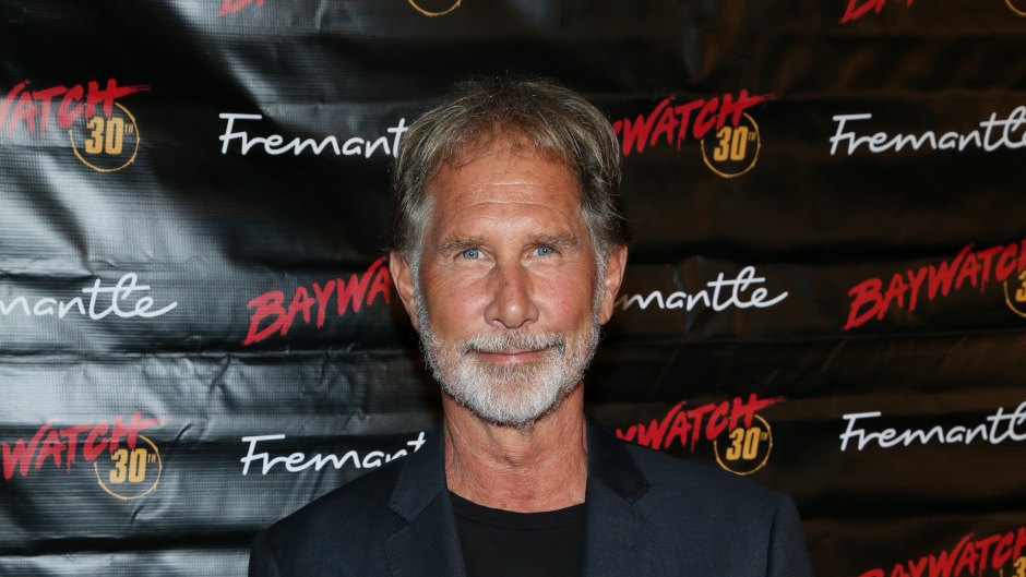 Parker Stevenson poses in a suit jacket and jeans