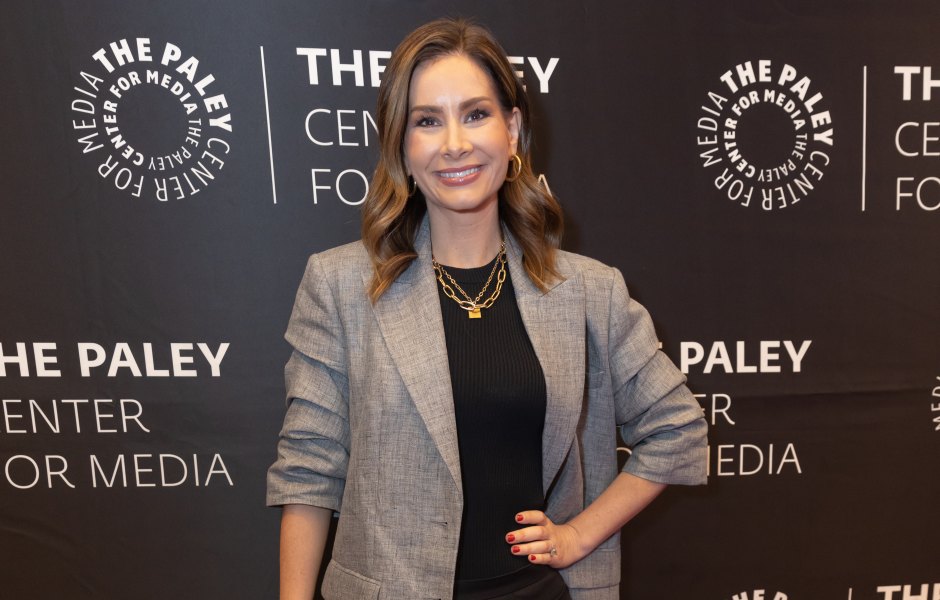 Rebecca Jarvis wears black outfit and gray blazer no red carpet