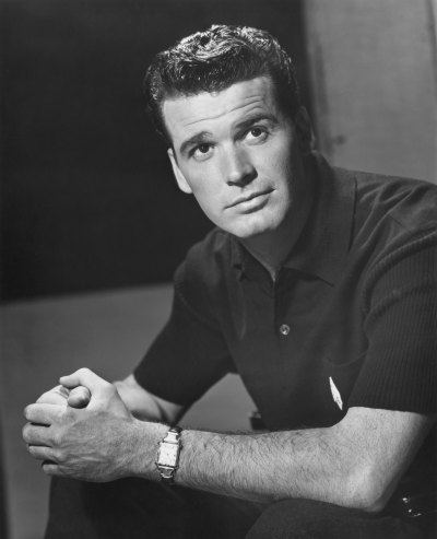 James Garner sits with his hands clasped