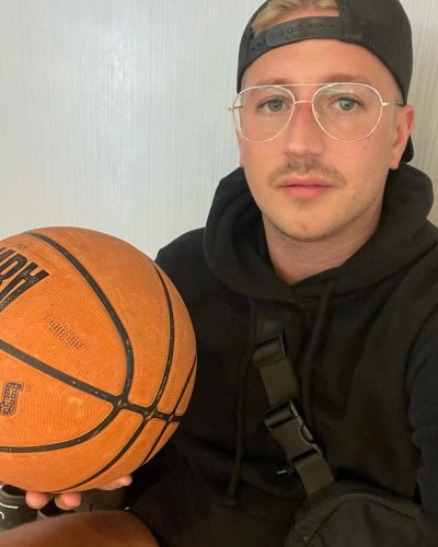 MJ Coyle poses with a basketball in his hand