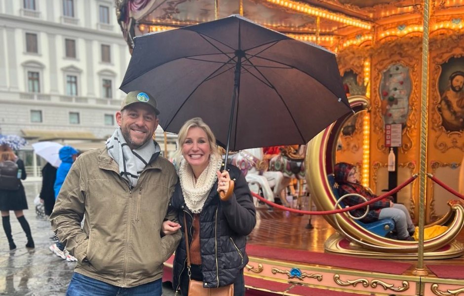Dave and Jenny Marrs stand in front of carousel