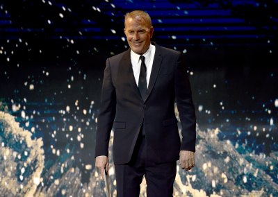 Kevin Costner wears black suit on stage