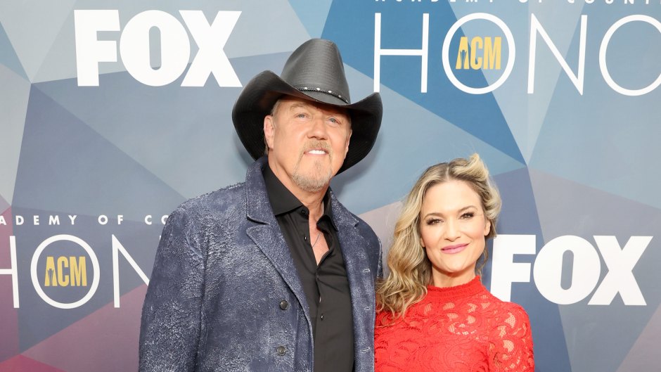 Trace Adkins wears blue jacket and cowboy hat with wife Victoria Pratt