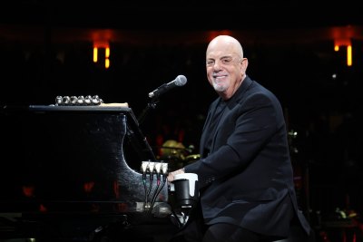 Billy Joel sits at piano and sings 