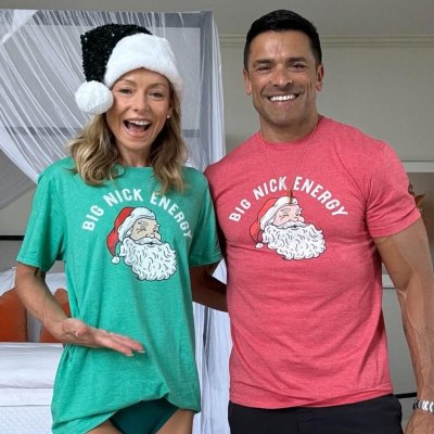 Kelly Ripa and Mark Consuelos pose in matching Christmas shirts that read 'Big Nick Energy'