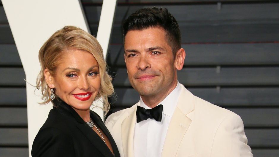 Kelly Ripa and Mark Consuelos wear black and white suits