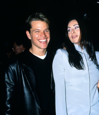 Matt Damon smiles while posing next to Minnie Driver