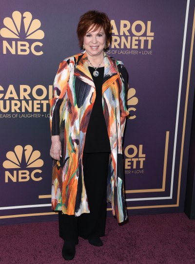 Vicki Lawrence in a colorful coat and black pants