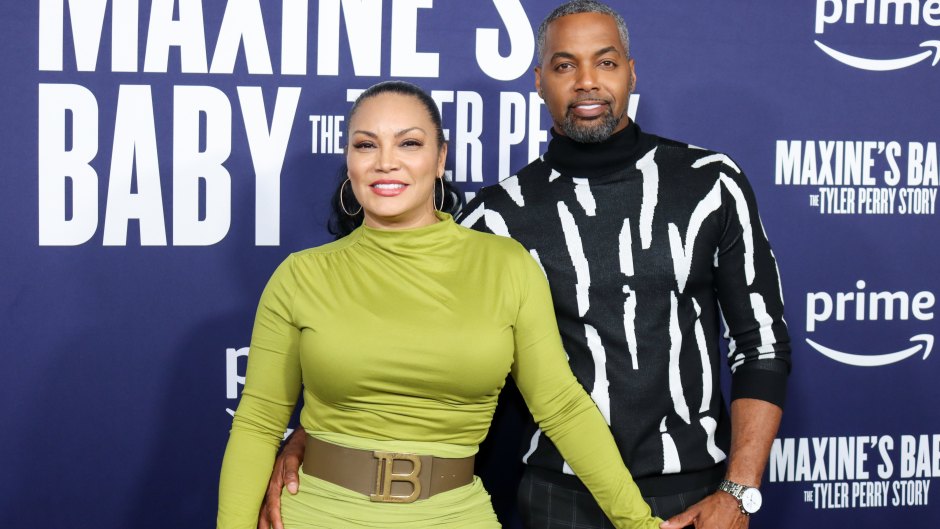 Egypt Sherrod and Mike Jackson hold hands on red carpet