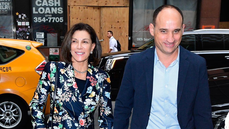 Hilary Farr smiles while walking with costar David Visentin