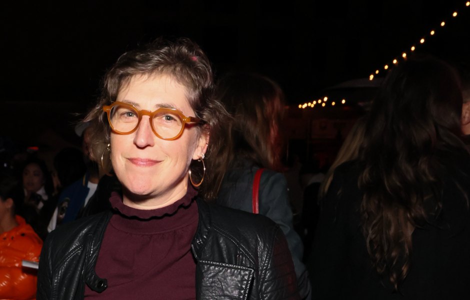Mayim Bialik wears maroon outfit with black leather jacket