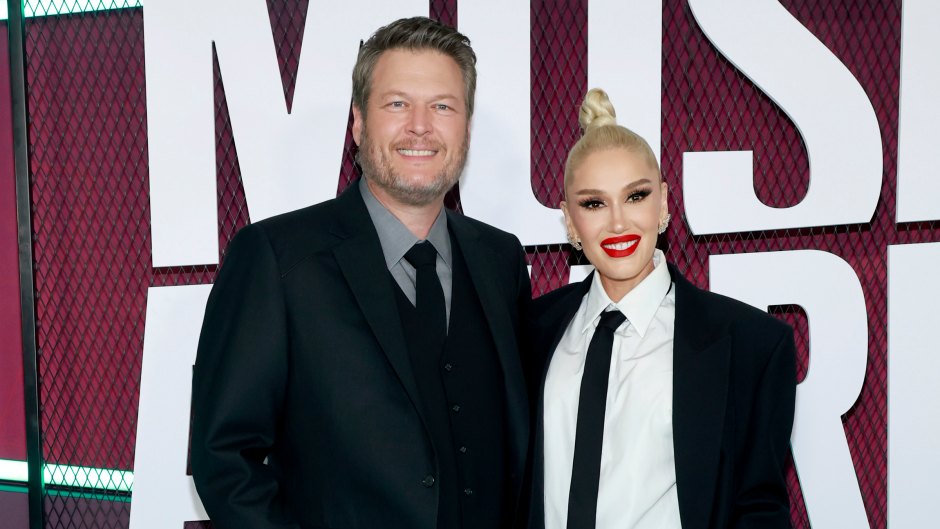 Blake Shelton in a suit jacket and jeans with wife Gwen Stefani