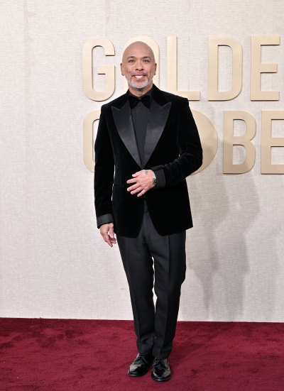 Joy Koy in a black tuxedo on the Golden Globes red carpet
