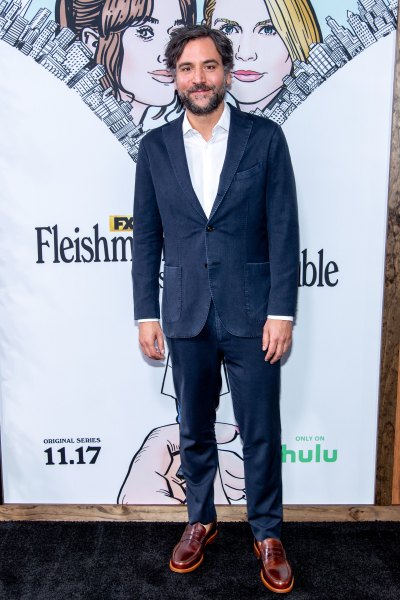 Josh Radnor in a blue suit and brown shoes
