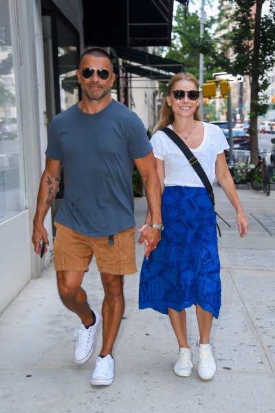 Kelly Ripa and Mark Consuelos hold hands during walk